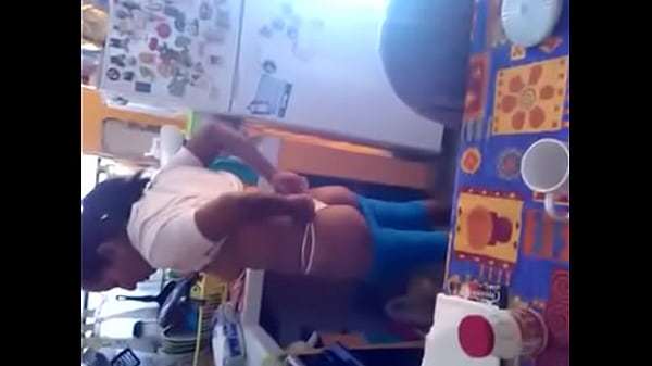 Woman showing her tits in the kitchen